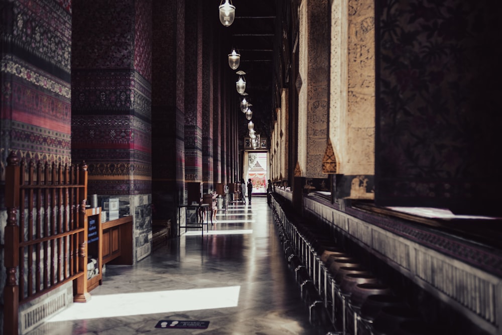 a long hallway in a building with a lot of chairs