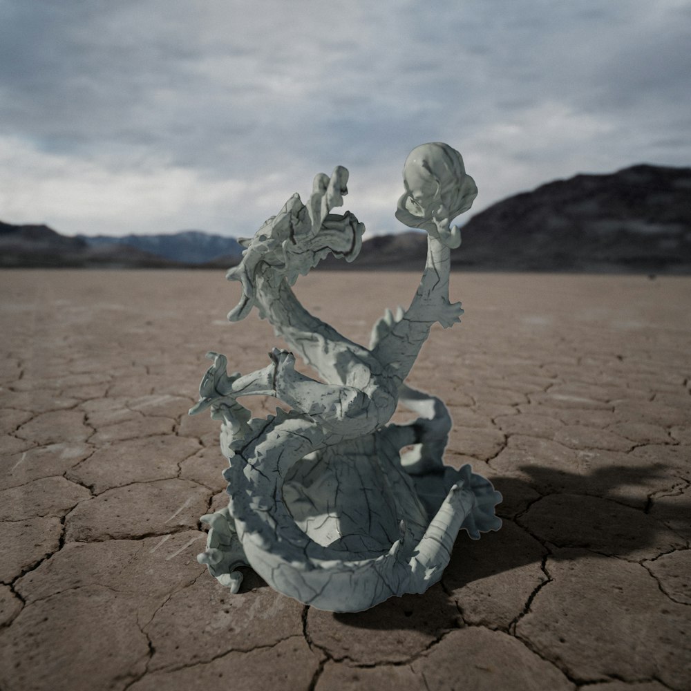 a broken vase sitting in the middle of a desert