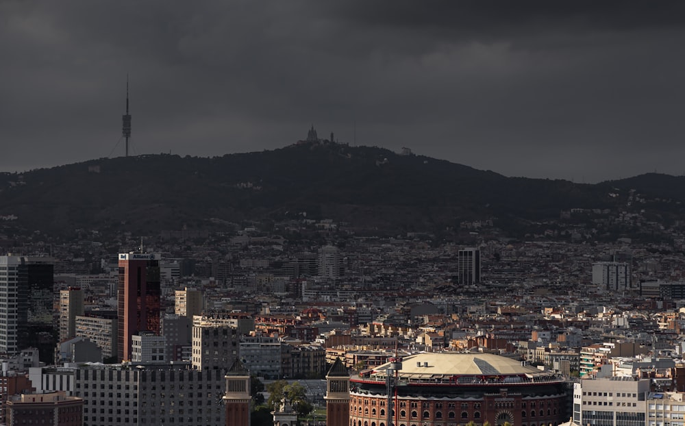 a view of a city with a mountain in the background