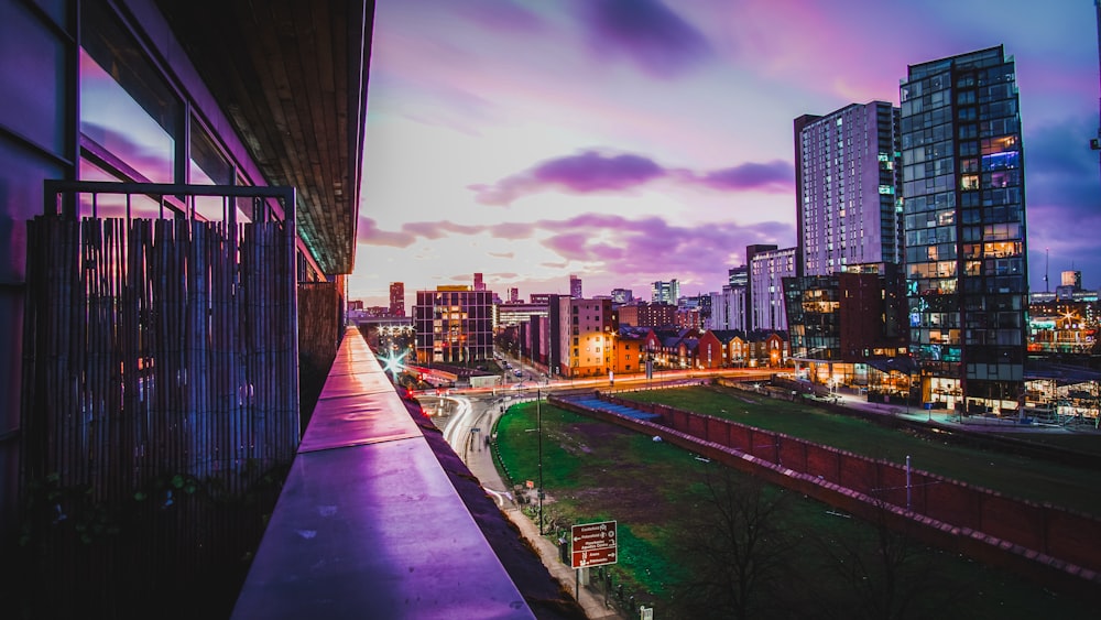 a view of a city at night from a balcony