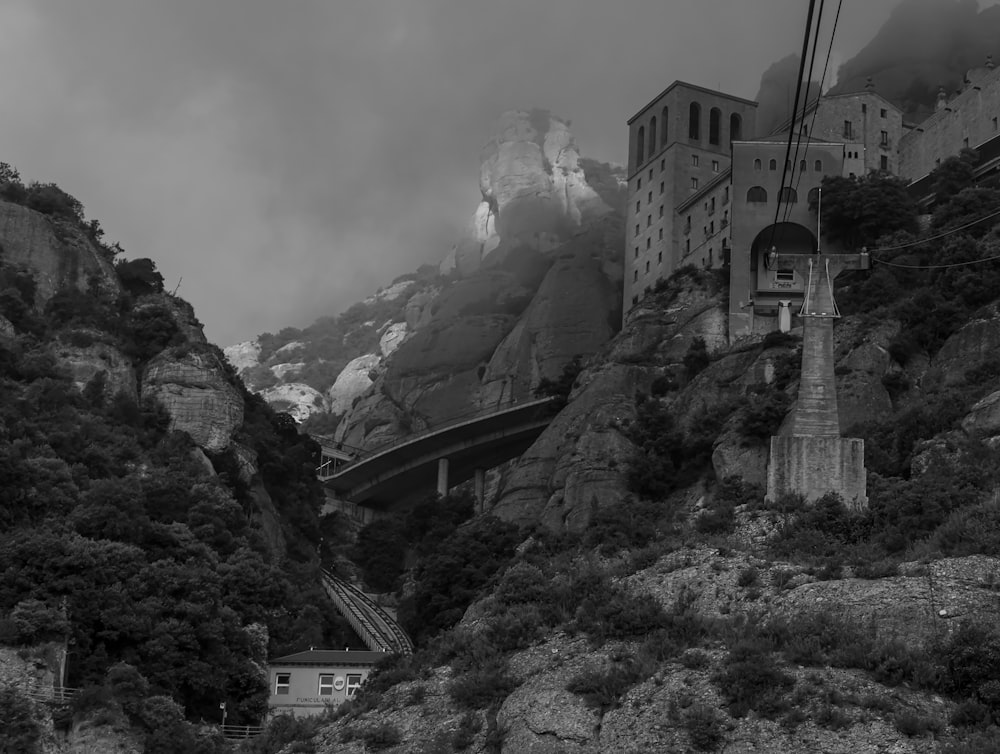 a black and white photo of a mountain town