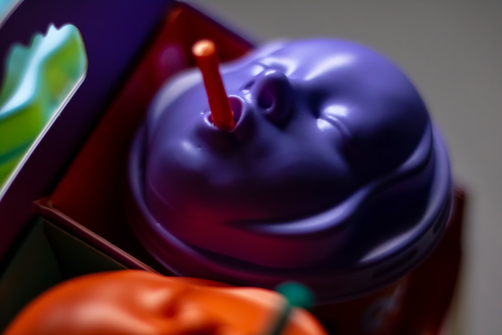 a purple and orange cake in a box