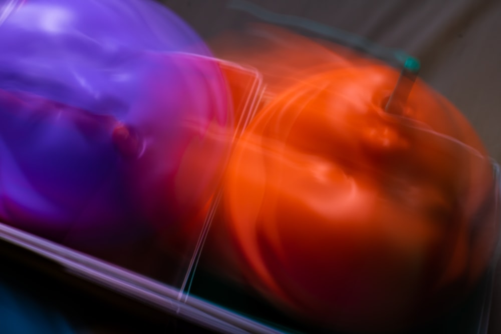 a close up of a bowl of fruit with a blurry background