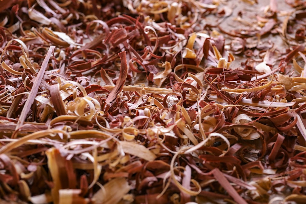 a close up of a pile of shredded brown paper