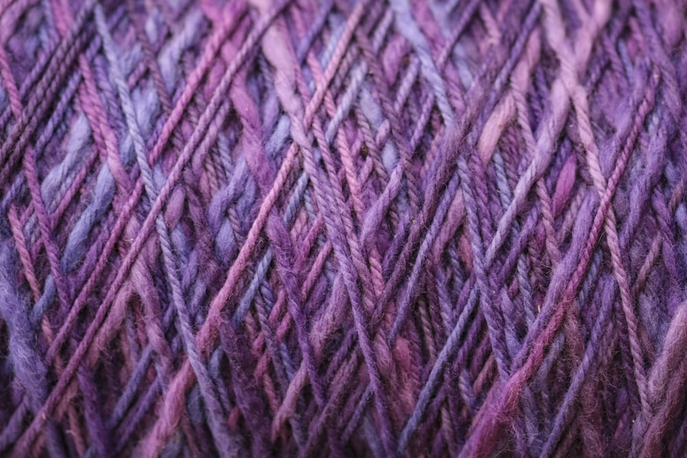 a close up of a purple and purple yarn
