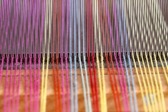 a close up of a colorful weaving machine