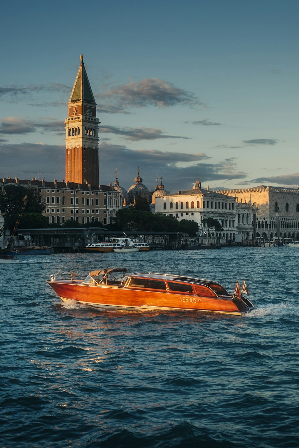 an orange boat in a body of water