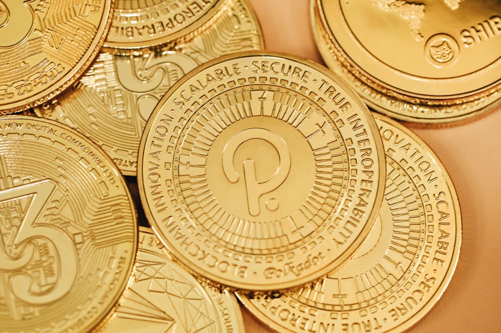 a pile of gold coins sitting on top of a table