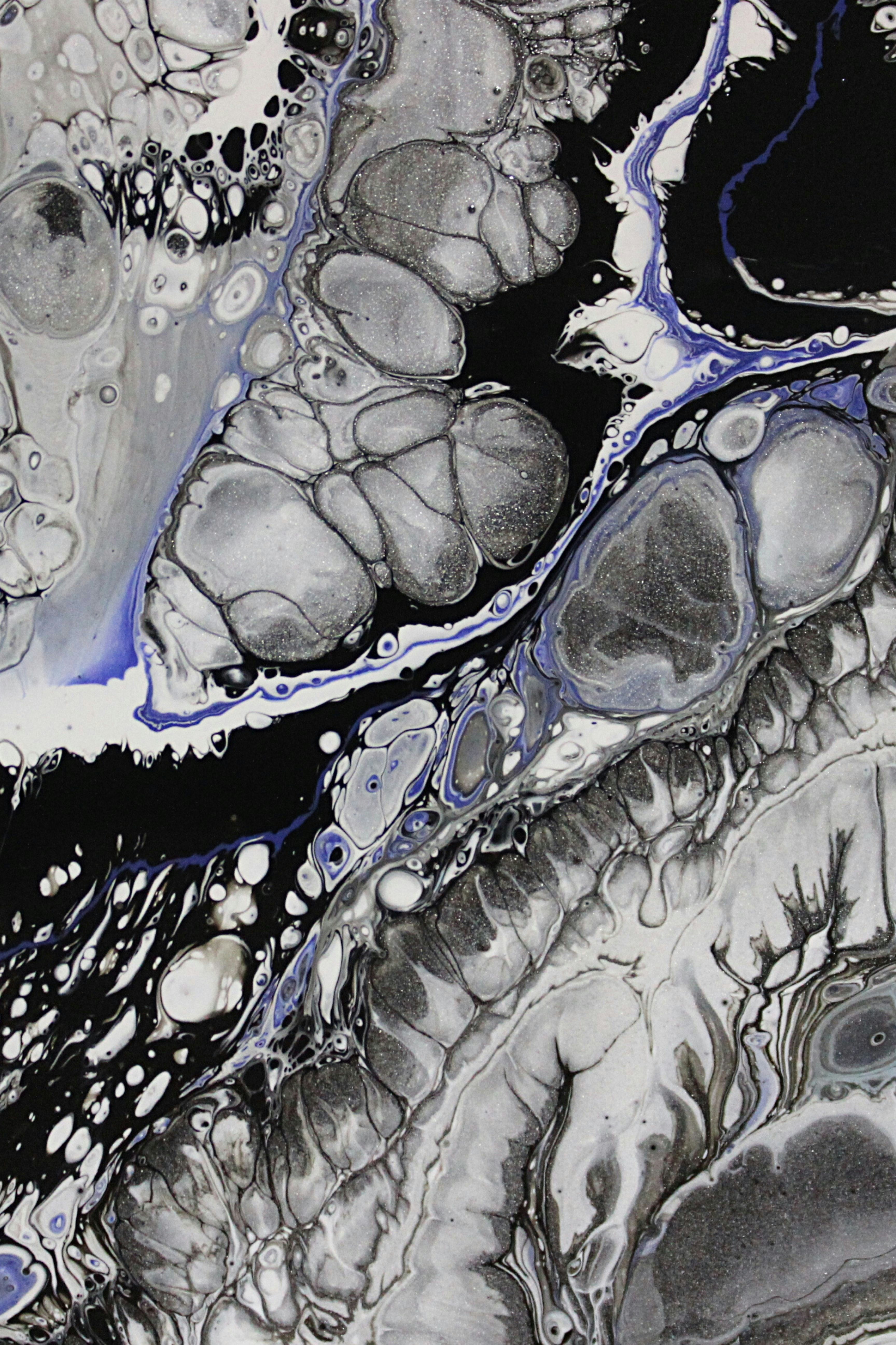 a black and white abstract painting with blue accents