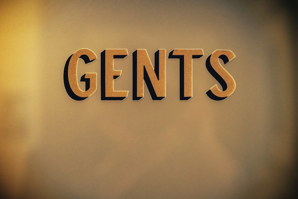 the word gents spelled with cut out letters