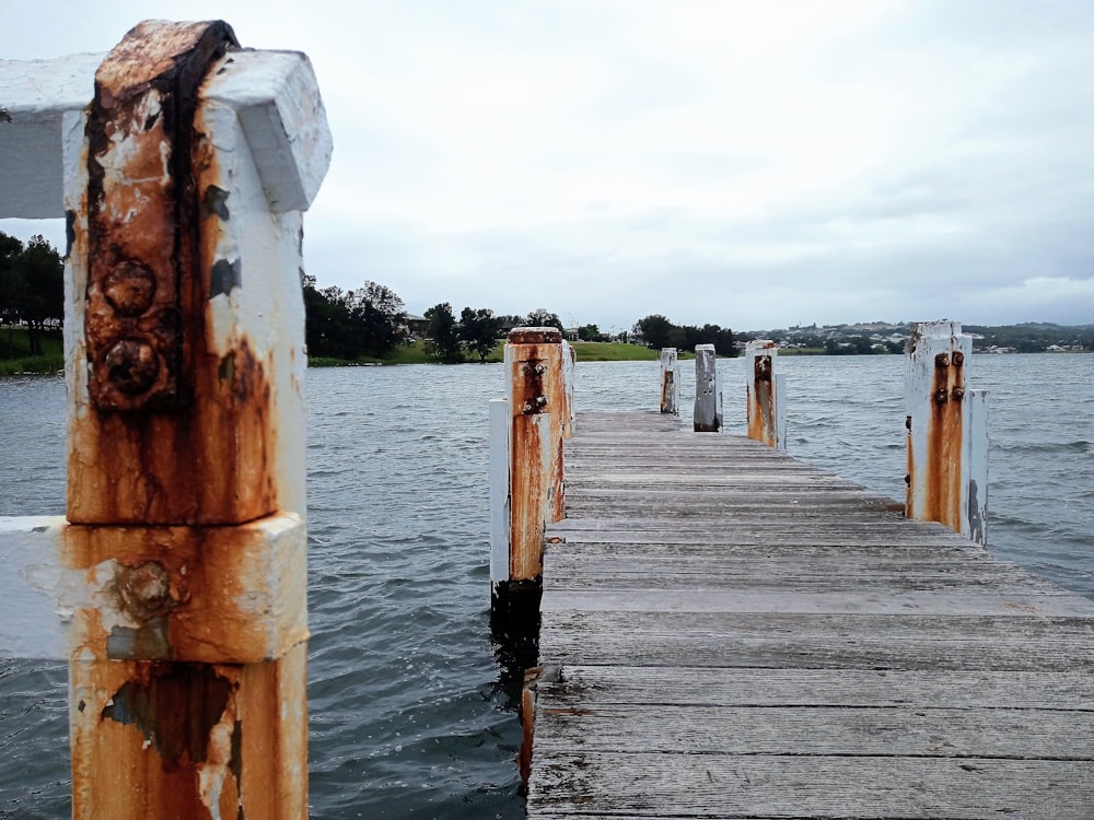 a wooden dock sitting next to a body of water