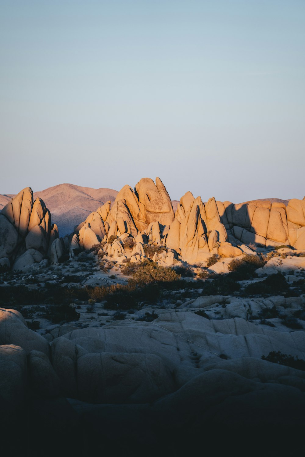 a group of large rocks in the desert