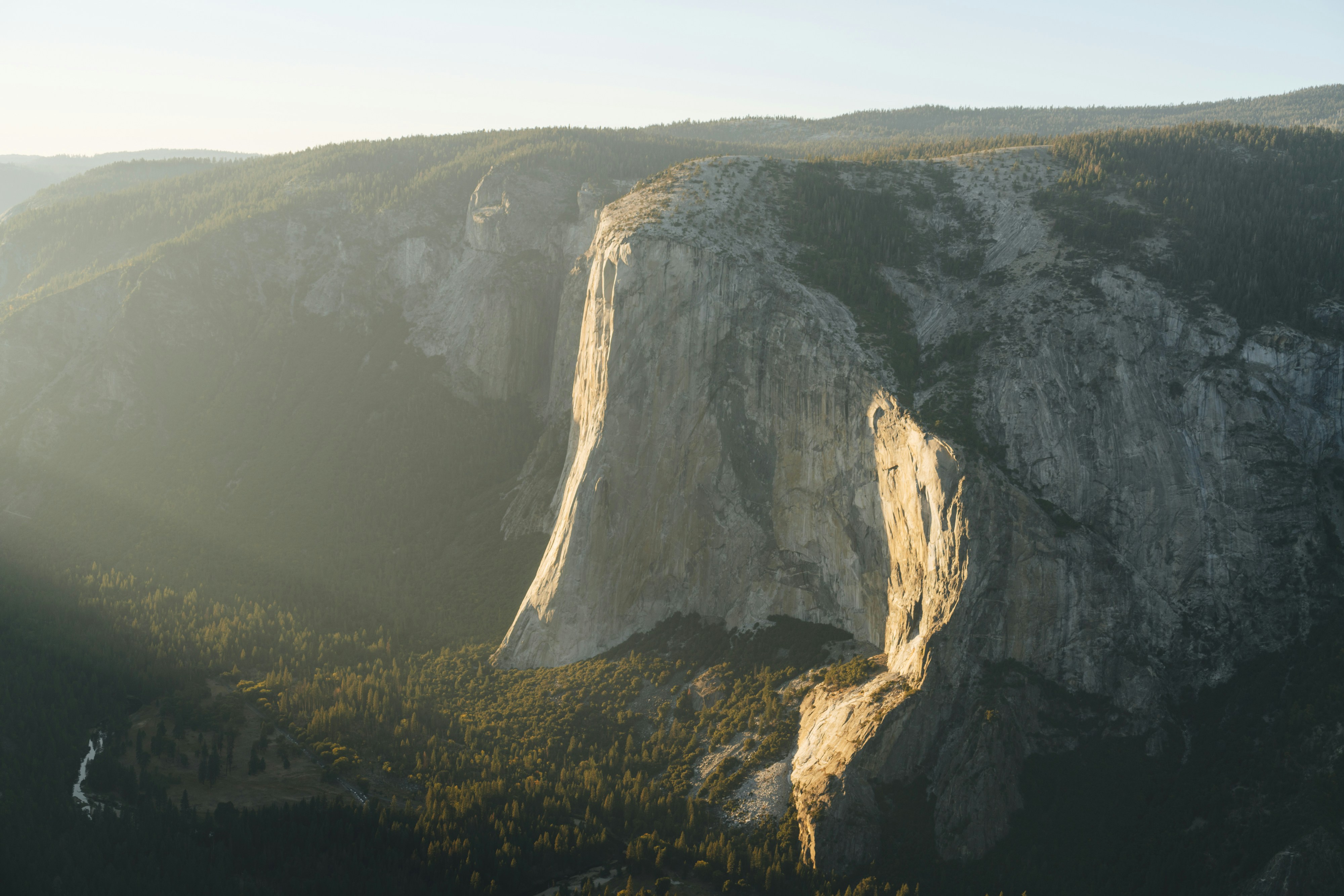 a view of a mountain with a cliff in the background