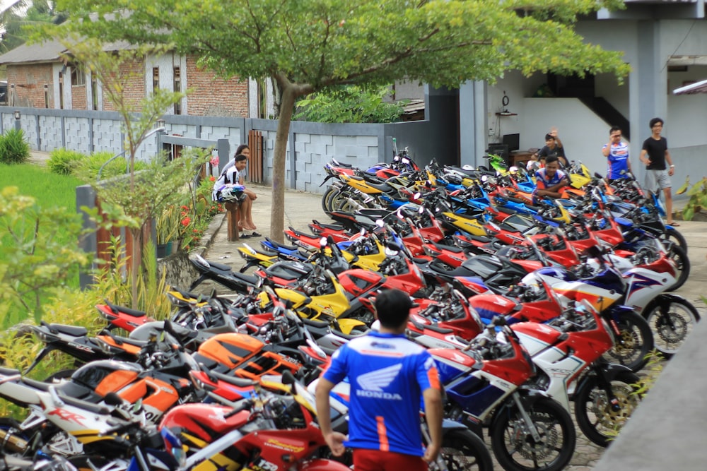 a large group of motorcycles parked next to each other