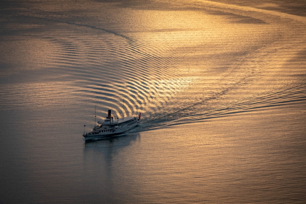 a boat traveling across a large body of water