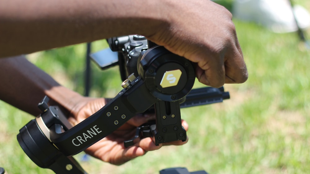 a person holding a camera in their hand