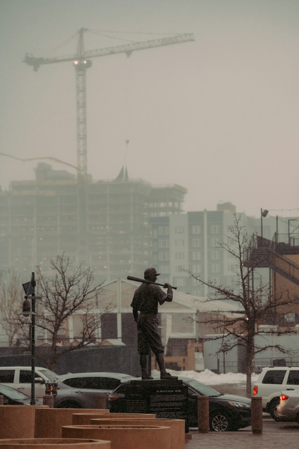 a statue of a man holding a baseball bat