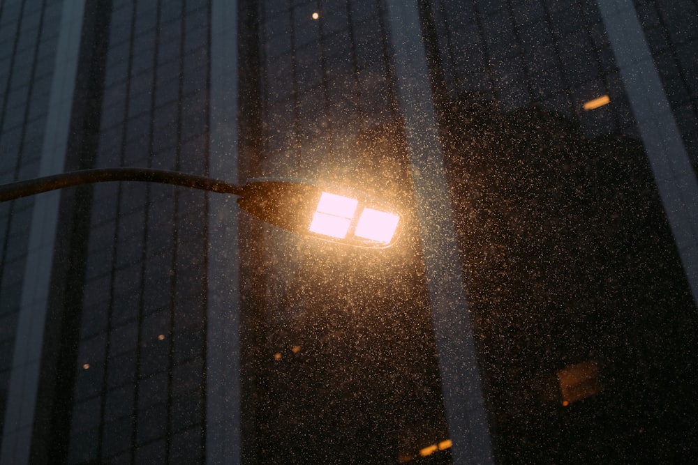 a street light with a building in the background