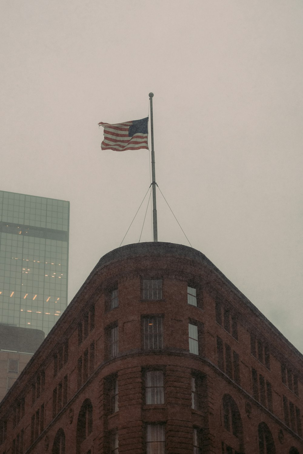 an american flag on top of a building