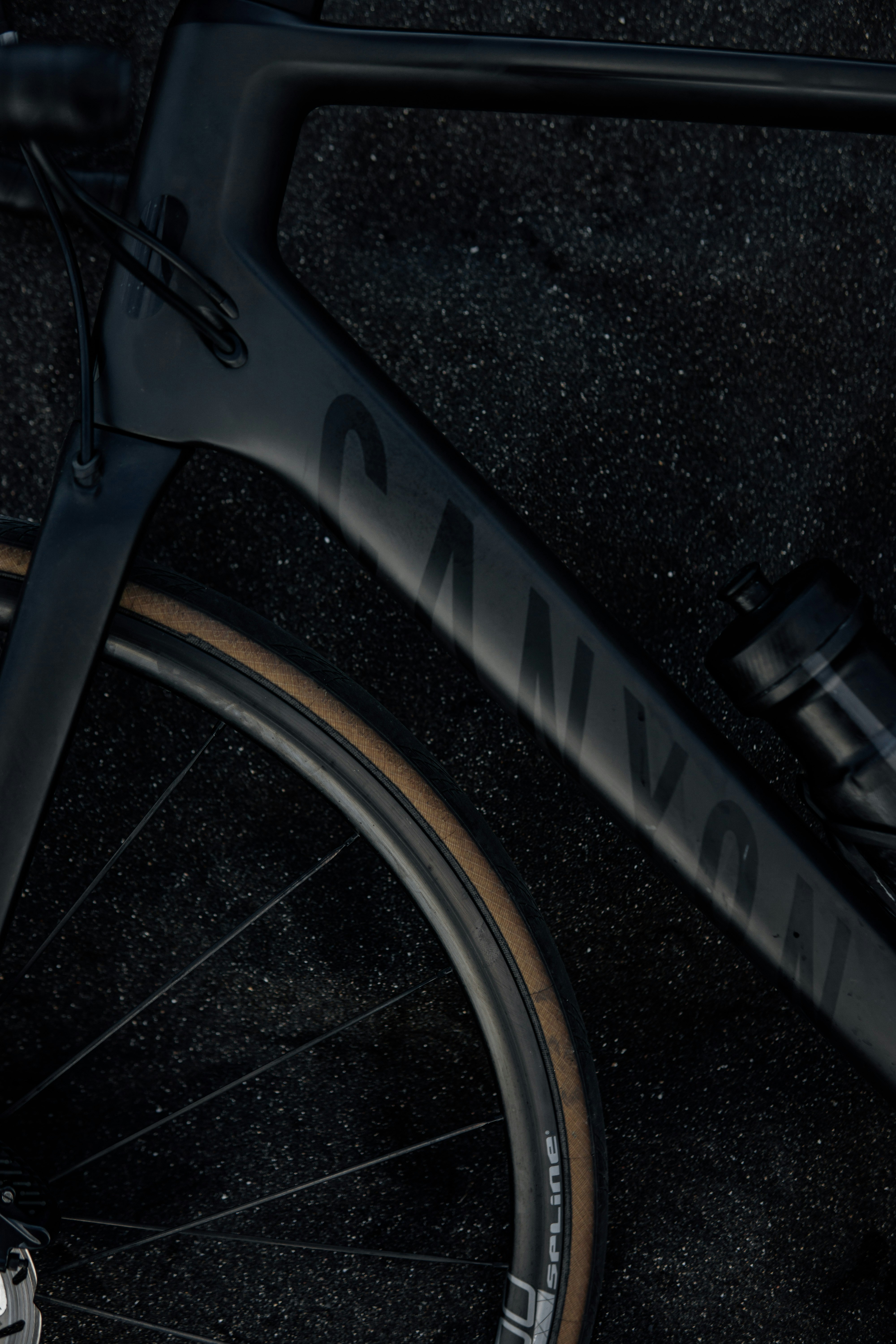 a bicycle is parked next to a car