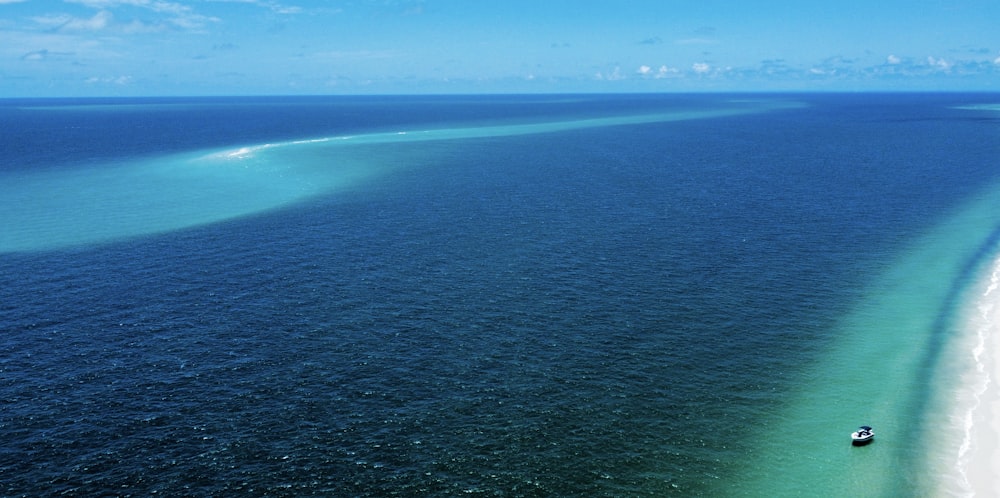 a boat is in the middle of the ocean