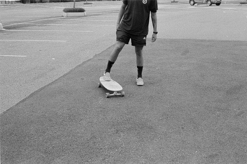 a man standing in a parking lot