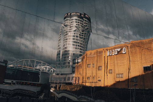 a reflection of a building in the glass of another building
