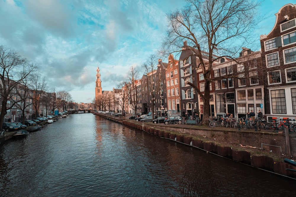 a river running through a city next to tall buildings