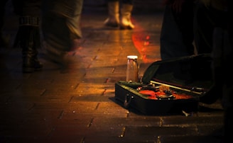 A welcoming front door with a small welcome mat and a violin case leaning nearby.