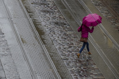 A sleek, lightweight jacket worn by a person walking through a rainy city street, looking comfortable and dry.