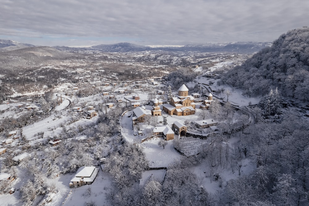 an aerial view of a snow covered village