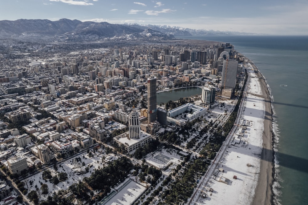 an aerial view of a city with snow on the ground