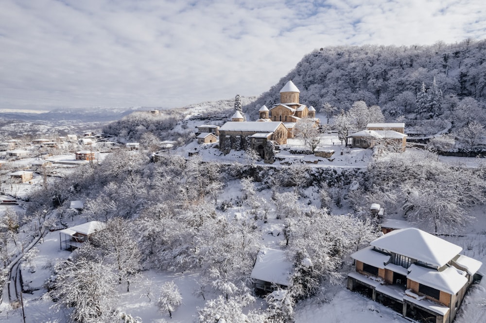 an aerial view of a snow covered village