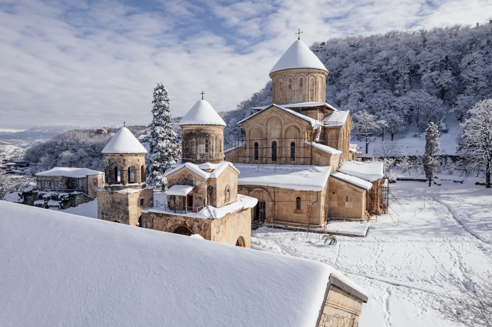 a church in the middle of a snowy landscape