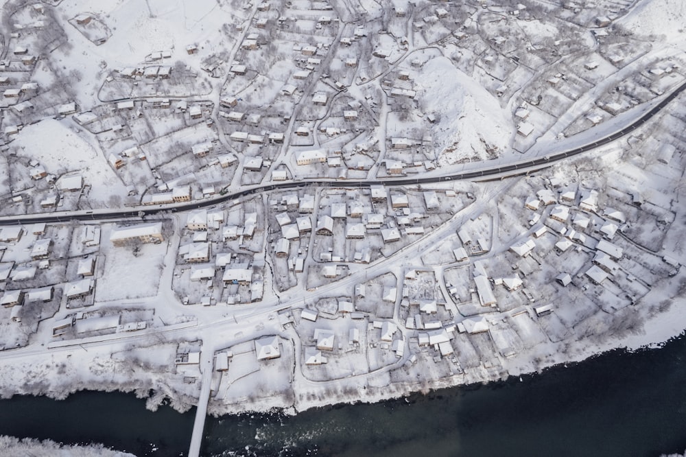 an aerial view of a snow covered city