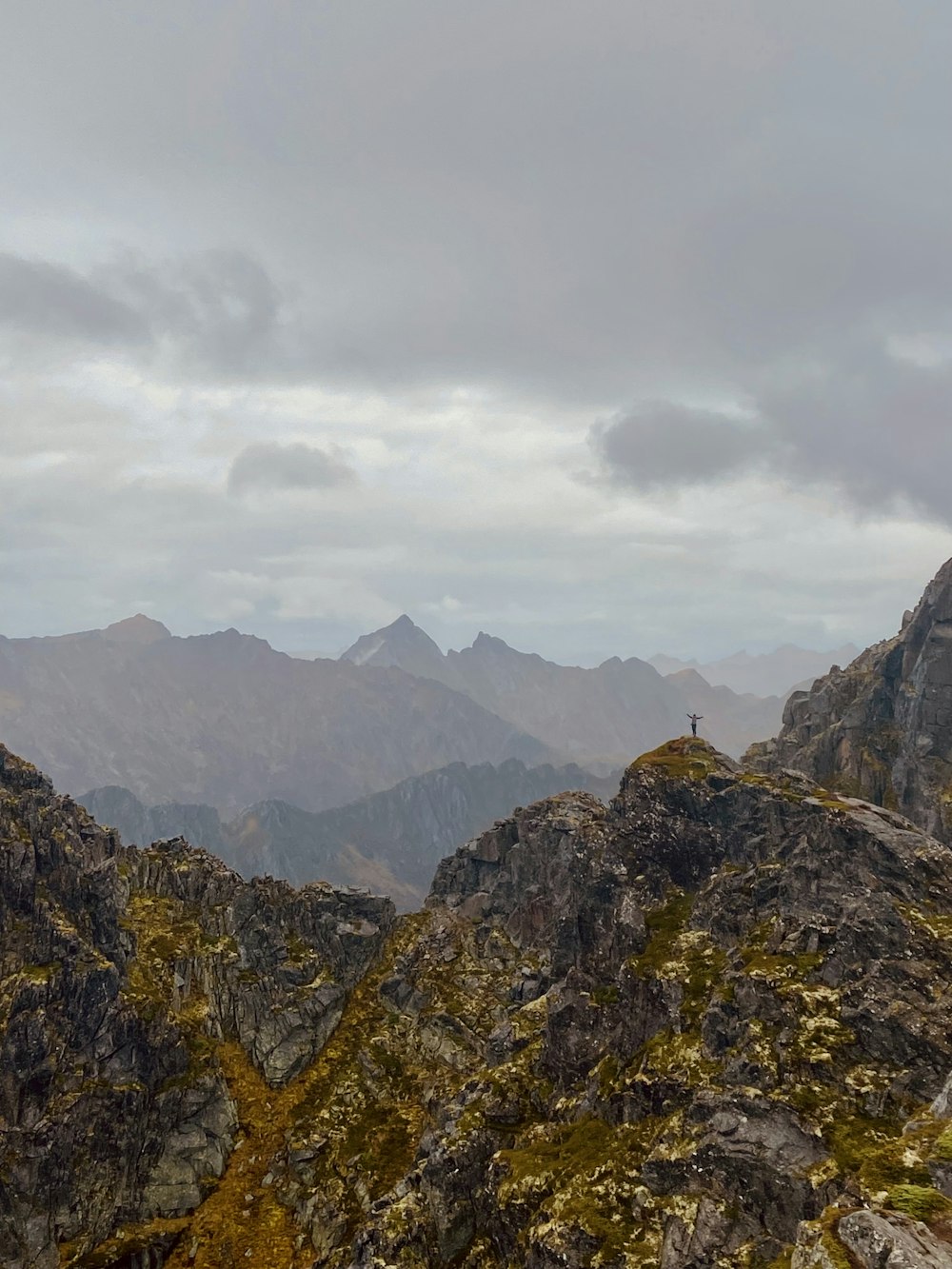 a person standing on top of a mountain