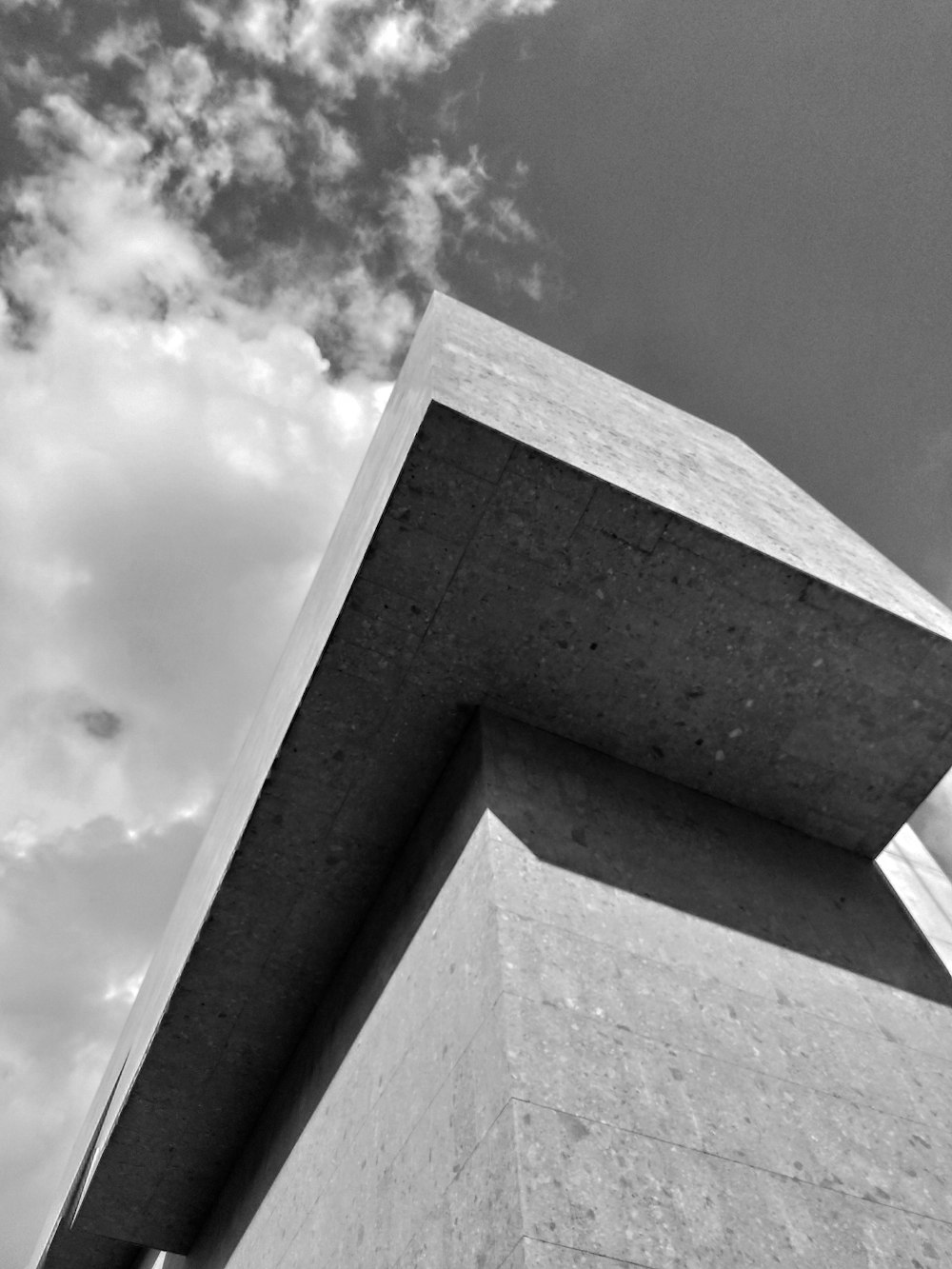 a black and white photo of a tall building