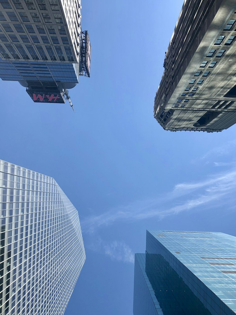 looking up at tall buildings in a city