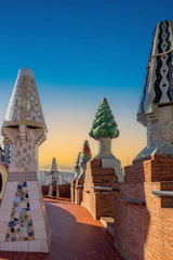 a row of chimneys with a tree on top of them