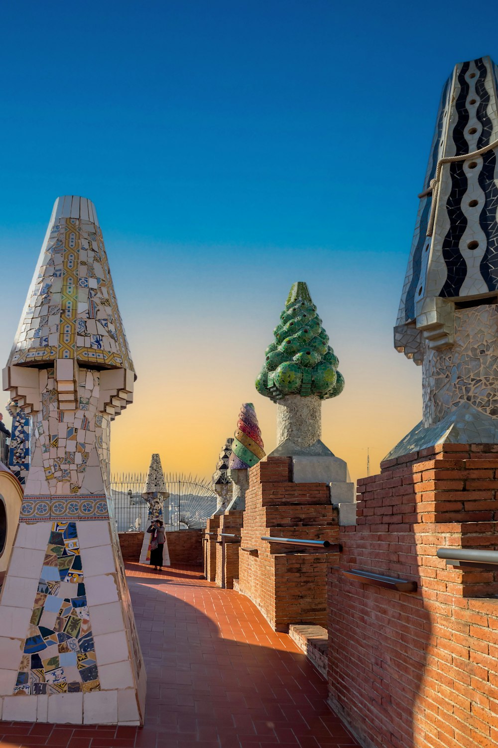 a row of chimneys with a tree on top of them