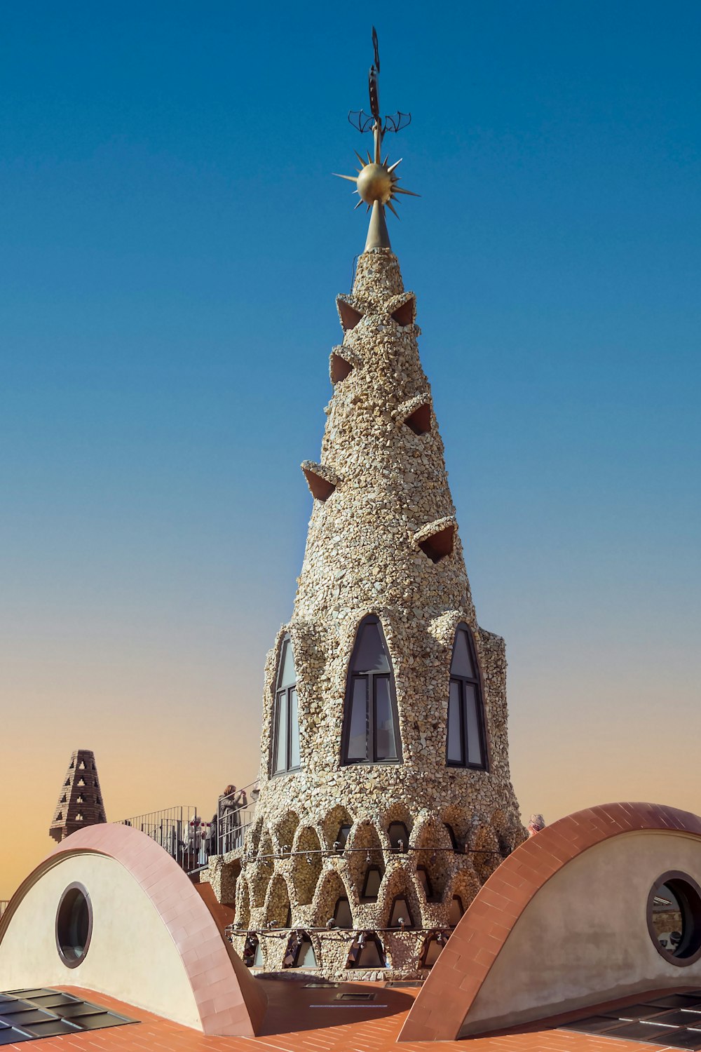 a building made out of rocks with a star on top