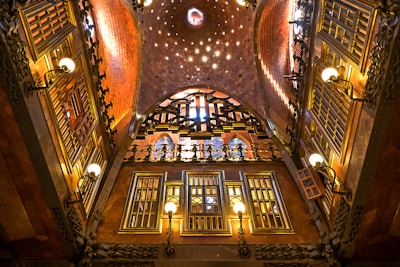 the ceiling of a building with many windows