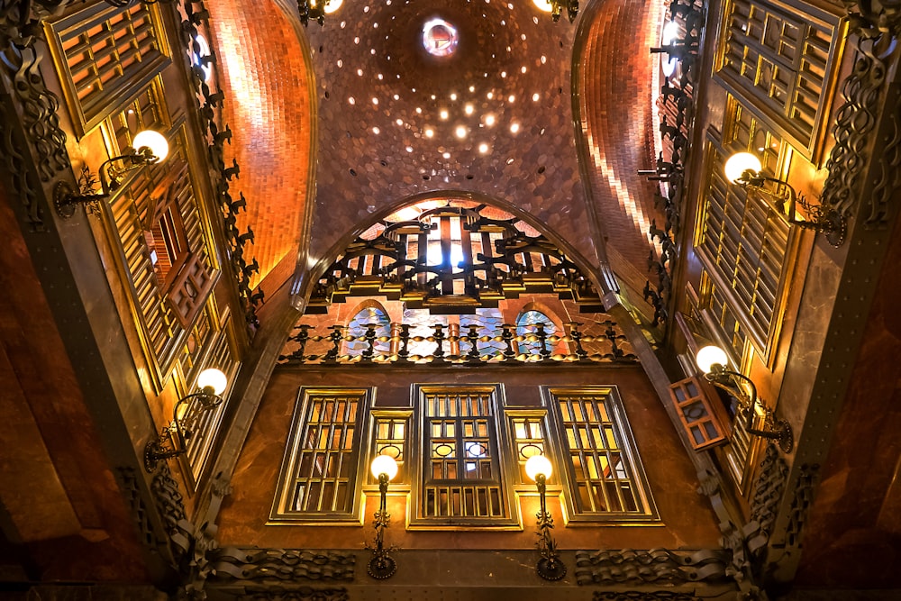 the ceiling of a building with many windows