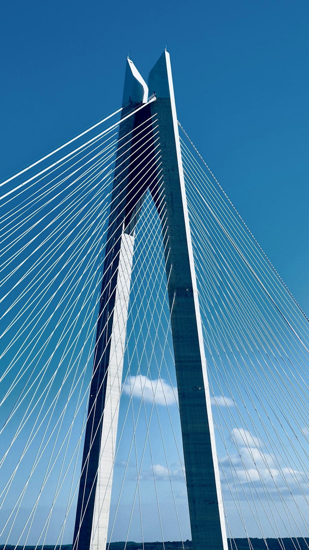 a very tall bridge with a sky background