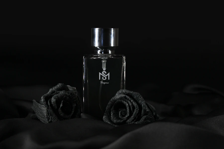 a bottle of perfume sitting on top of a bed
