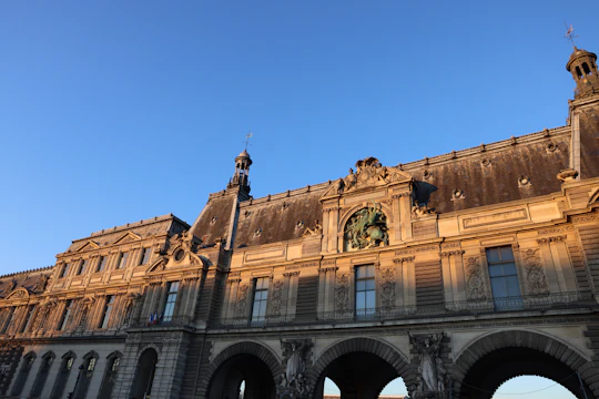 An aged stone building bathed in golden light, symbolizing enduring cultural heritage.