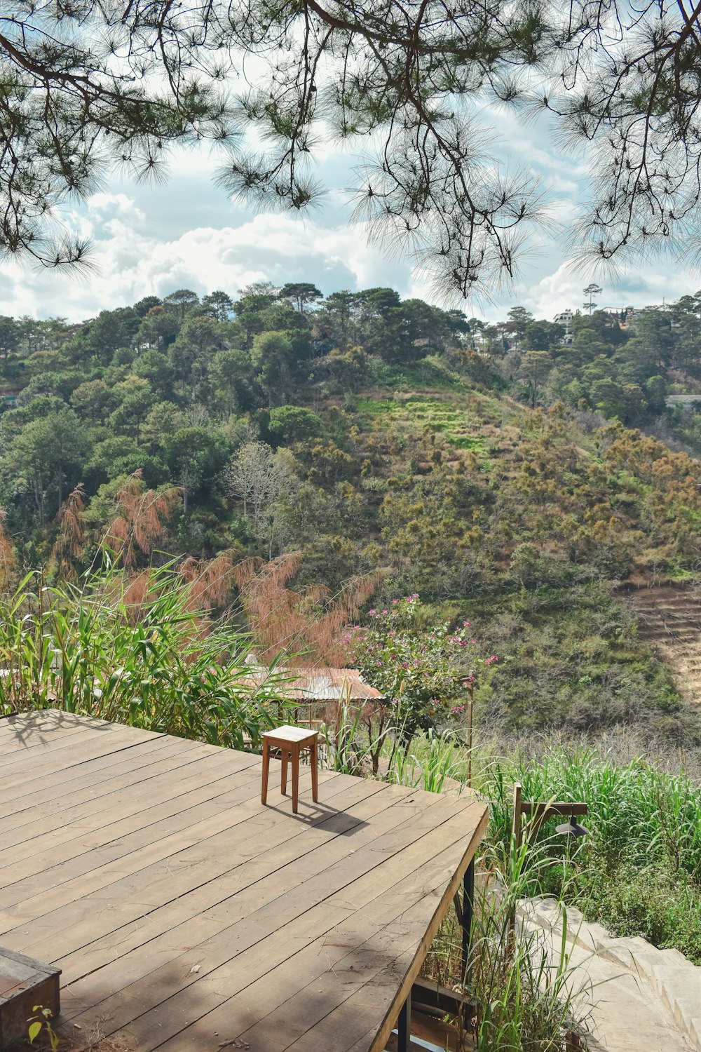 a wooden deck with a table on top of it