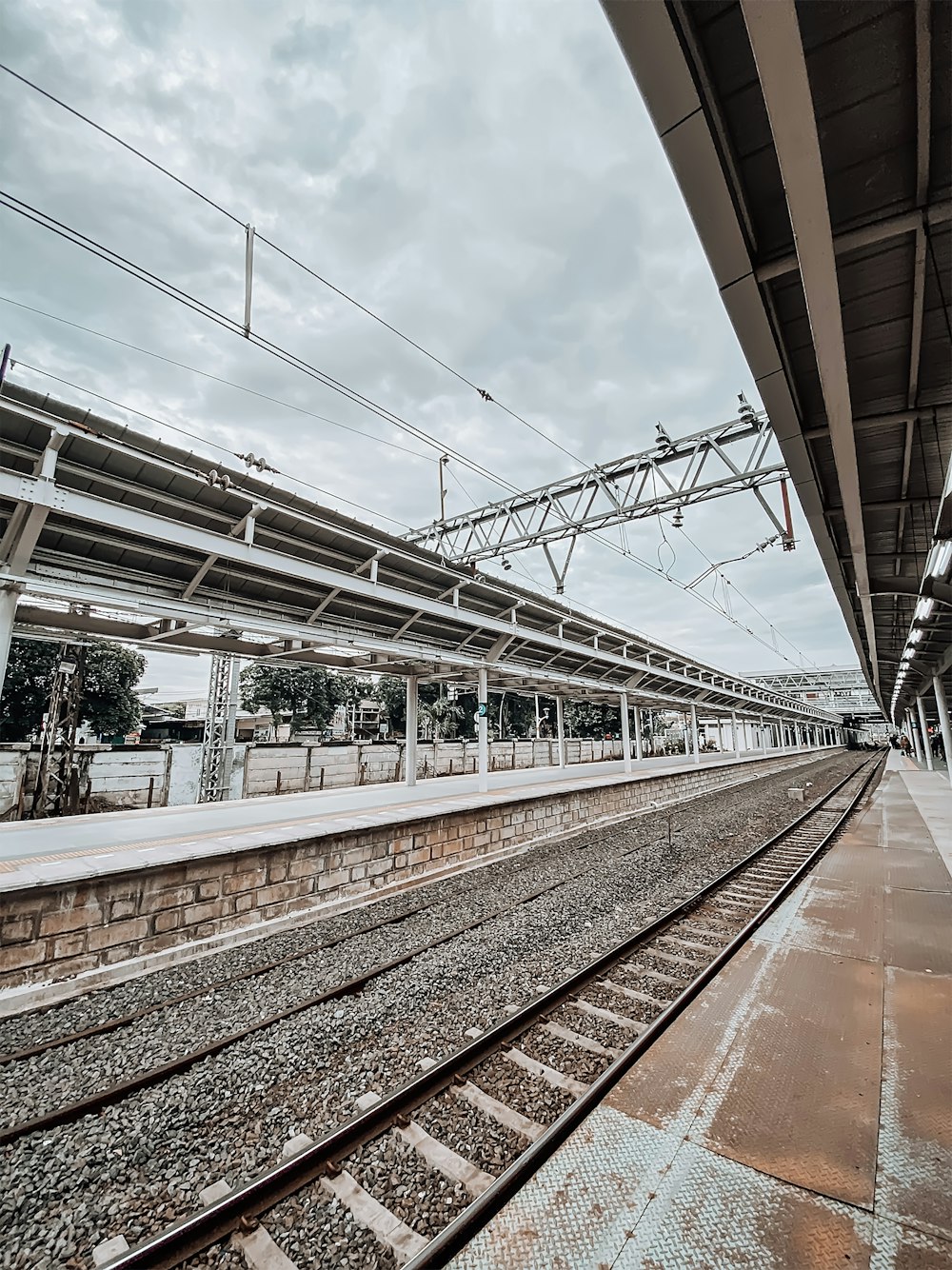 a train station with a train on the tracks