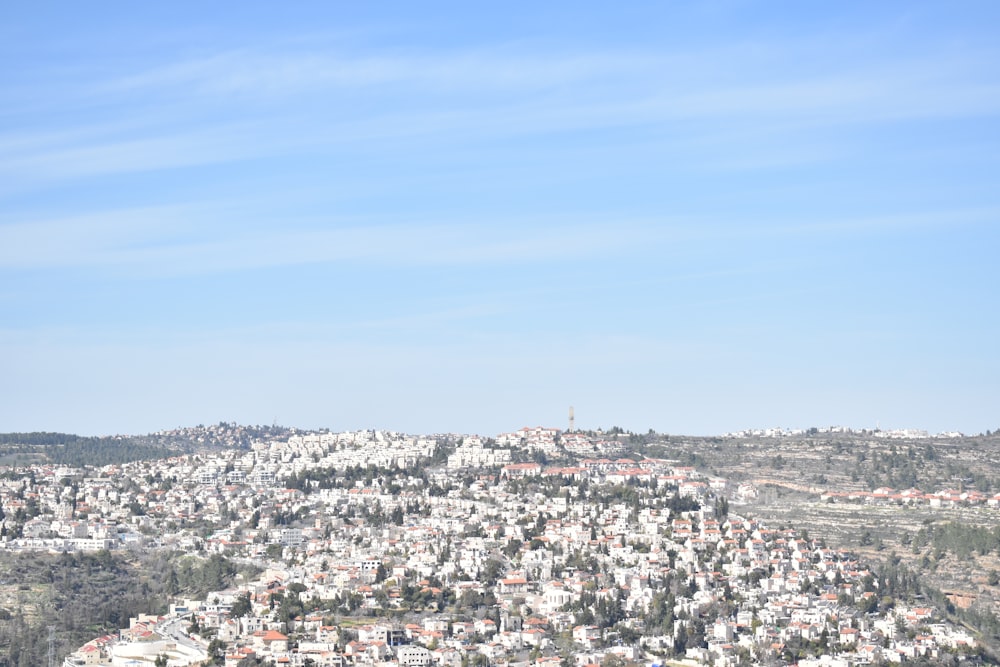 a view of a city from the top of a hill