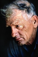 An intimate portrait of an elderly person reflecting on life.